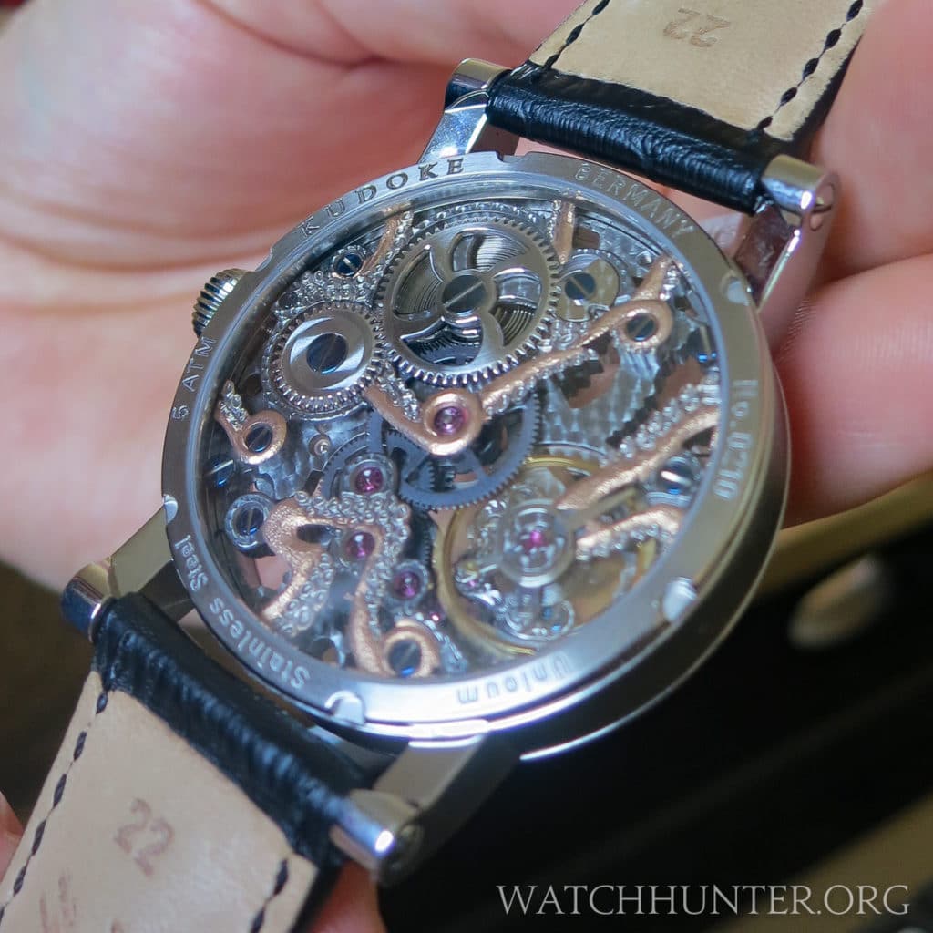 The Kudoktopus watch has an octopus with tentacles on the front and back of the movement