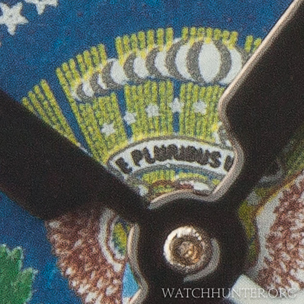 The scroll with the USA motto is there as are the clouds, stars and sunburst.