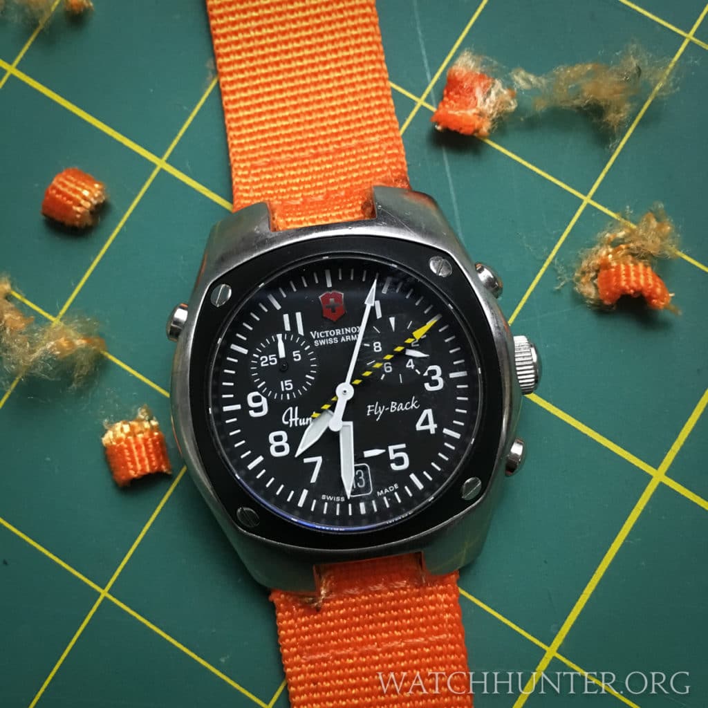 A Victorinox Swiss Army Hunter Mach 2 on an orange nylon strap. It only cost $4.