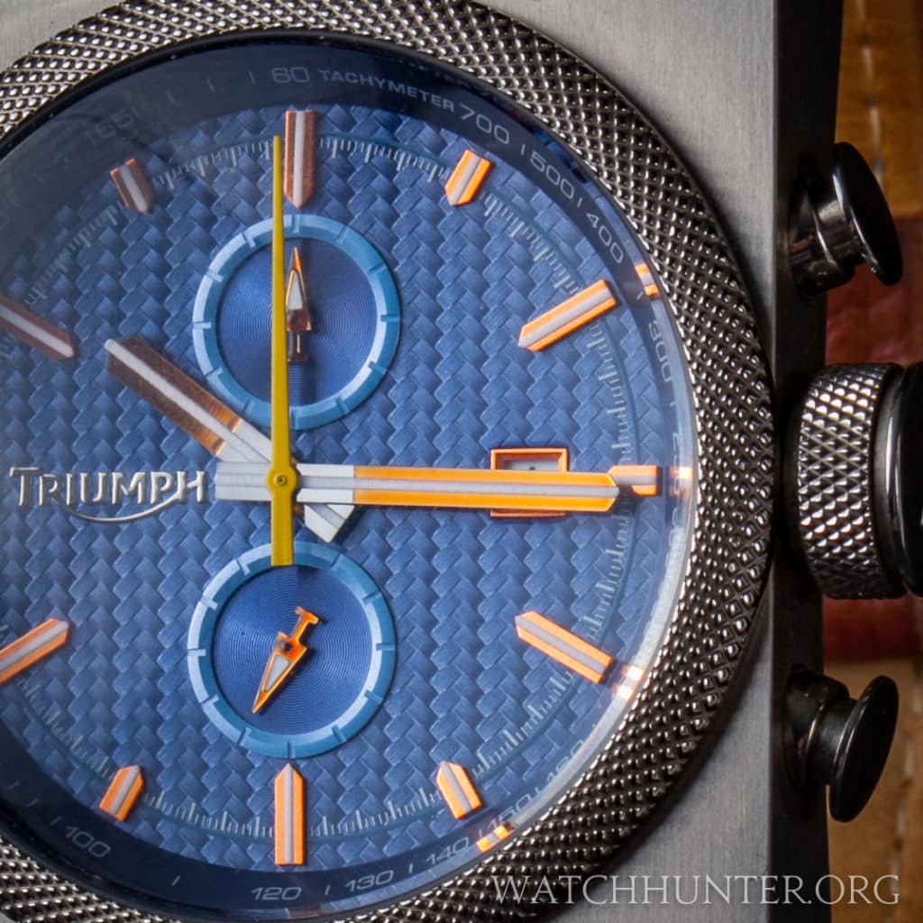 Real carbon fiber weave, applied copper markers and tachymeter scale on the Triumph Scrambler Dial.